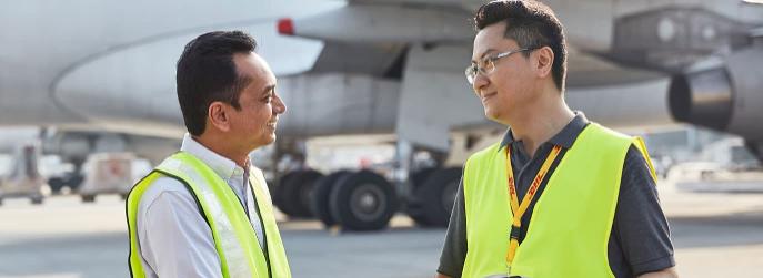 Employees in front of an aircraft