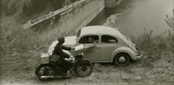 Deutsche Post motorcycle courier and VW Beetle